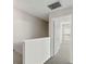 Hallway with neutral walls, white trim, and carpeted floors leading to rooms with white doors at 4447 Brook Hollow Cir, Winter Springs, FL 32708