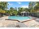 Community pool featuring lounge chairs and a covered pavilion area, perfect for relaxation at 4447 Brook Hollow Cir, Winter Springs, FL 32708