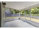 A screened porch that offers an outdoor relaxation space, shielding from insects with views of the backyard at 4447 Brook Hollow Cir, Winter Springs, FL 32708
