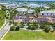 Aerial of a residential area with multi-story buildings, mature trees and well-maintained lawns at 4562 Lower Park Rd, Orlando, FL 32814