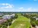 Beautiful aerial view of a neighborhood with a large grassy field and a modern apartment building at 4562 Lower Park Rd, Orlando, FL 32814