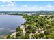 Beautiful aerial view of a lakefront community with cityscape in the background at 4562 Lower Park Rd, Orlando, FL 32814