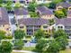 Aerial view of a multi-unit residential building with tile roofs and well-manicured landscaping at 4562 Lower Park Rd, Orlando, FL 32814