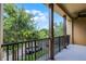 Relax on this covered balcony with views of the surrounding trees and enjoy the fresh air at 4562 Lower Park Rd, Orlando, FL 32814