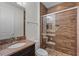 Modern bathroom featuring granite vanity top, tile shower, and neutral color scheme at 4562 Lower Park Rd, Orlando, FL 32814