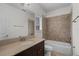 This cozy bathroom features granite countertops, a bathtub, and a tiled shower at 4562 Lower Park Rd, Orlando, FL 32814