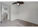 Bright bedroom showcases neutral paint, plush carpet, and a modern ceiling fan at 4562 Lower Park Rd, Orlando, FL 32814