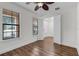 Charming bedroom with natural light, vinyl floors and a modern ceiling fan at 4562 Lower Park Rd, Orlando, FL 32814
