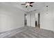 Bright bedroom with soft neutral carpet, fan, and easy access to an ensuite at 4562 Lower Park Rd, Orlando, FL 32814