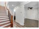 Bright hallway featuring hardwood floors, stairs, and easy access to a bathroom and a bedroom at 4562 Lower Park Rd, Orlando, FL 32814