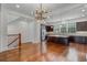 Open kitchen and dining area with a large island, dark cabinets and stainless steel appliances at 4562 Lower Park Rd, Orlando, FL 32814