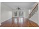 Bright living room with hardwood floors, a ceiling fan, and French doors to a patio at 4562 Lower Park Rd, Orlando, FL 32814
