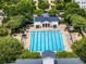 Aerial view of a large community pool surrounded by lounge chairs and trees at 4562 Lower Park Rd, Orlando, FL 32814