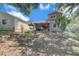 Backyard view of two-story home with patio and manicured yard, providing a serene outdoor space at 503 Portland Cir, Apopka, FL 32703