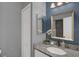 Bathroom with a vanity with granite countertop and framed mirror at 503 Portland Cir, Apopka, FL 32703