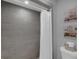 Clean bathroom with tiled shower, decorative accents, and modern fixtures at 503 Portland Cir, Apopka, FL 32703