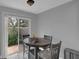 View of the table in the breakfast nook with sliding glass door to the outside patio at 503 Portland Cir, Apopka, FL 32703