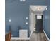 Home entryway featuring hardwood floors, vibrant paint and stylish door at 503 Portland Cir, Apopka, FL 32703