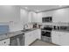 Modern kitchen with stainless steel appliances, sleek cabinetry, and granite countertops at 503 Portland Cir, Apopka, FL 32703