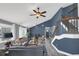 Open-concept living room with staircase features gray paint, vaulted ceiling, and lots of natural light at 503 Portland Cir, Apopka, FL 32703