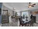 Open concept space includes stairs, dining room and a living room with a high ceiling at 503 Portland Cir, Apopka, FL 32703