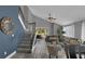 Bright living space includes a staircase with a large sitting area and dining space at 503 Portland Cir, Apopka, FL 32703