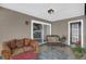 Inviting covered patio with comfortable seating and neutral tones, perfect for relaxation at 503 Portland Cir, Apopka, FL 32703