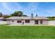 Well-maintained backyard with a lush green lawn and brick patio for outdoor enjoyment at 5130 Sun Palm Dr, Windermere, FL 34786