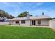 This home features a well-maintained lawn and a brick patio for outdoor entertaining at 5130 Sun Palm Dr, Windermere, FL 34786