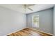 Bedroom featuring wood floors and natural light at 5130 Sun Palm Dr, Windermere, FL 34786