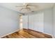 Bedroom featuring wood-look floors and a closet for plenty of storage at 5130 Sun Palm Dr, Windermere, FL 34786