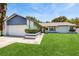 Charming single-story home featuring a well-manicured lawn and neutral tones at 5130 Sun Palm Dr, Windermere, FL 34786