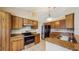 Kitchen featuring granite countertops, stainless steel appliances, and dark wood cabinets at 5130 Sun Palm Dr, Windermere, FL 34786