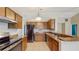 Spacious kitchen with stainless steel appliances, granite countertops and tile floor at 5130 Sun Palm Dr, Windermere, FL 34786