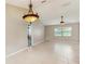 Open-concept living room with tile floors, chandelier and ceiling fan with views to other rooms at 5130 Sun Palm Dr, Windermere, FL 34786