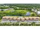 Beautiful aerial view of condo buildings surrounded by lush greenery and lakes at 563 Belltower Ave # 240, Deltona, FL 32725