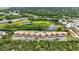 Overhead view of condos with lake and pond nearby at 563 Belltower Ave # 240, Deltona, FL 32725