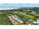 Stunning aerial view of condo community featuring well-kept landscaping, community pool, and lake views at 563 Belltower Ave # 240, Deltona, FL 32725