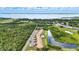 Long aerial shot of complex with lake view at 563 Belltower Ave # 240, Deltona, FL 32725