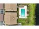 Aerial view of condo building and pool with beautiful green space at 563 Belltower Ave # 240, Deltona, FL 32725