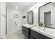 Bright bathroom with double vanity, modern sinks, and sleek gray cabinets at 563 Belltower Ave # 240, Deltona, FL 32725