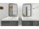 Bathroom featuring double sinks, modern fixtures, and well-lit mirrors at 563 Belltower Ave # 240, Deltona, FL 32725
