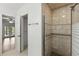 Shower with tiled walls, glass door, and convenient grab bar at 563 Belltower Ave # 240, Deltona, FL 32725