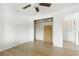 Bedroom with ceiling fan and spacious closet, ready for customization at 563 Belltower Ave # 240, Deltona, FL 32725