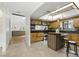 Spacious kitchen featuring tile floors, island, stainless appliances, and ample cabinetry at 563 Belltower Ave # 240, Deltona, FL 32725