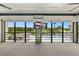 Enclosed lanai featuring a pool view and large screen TV at 563 Belltower Ave # 240, Deltona, FL 32725