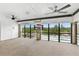 Spacious enclosed lanai with ceiling fans and scenic pool view at 563 Belltower Ave # 240, Deltona, FL 32725