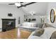 Comfortable living room with a fireplace and a large sectional couch at 563 Belltower Ave # 240, Deltona, FL 32725