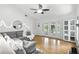 Bright living room with wood floors and a large ceiling fan at 563 Belltower Ave # 240, Deltona, FL 32725