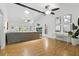 Bright living room with wood floors, ceiling fans, and a sleek black fireplace at 563 Belltower Ave # 240, Deltona, FL 32725